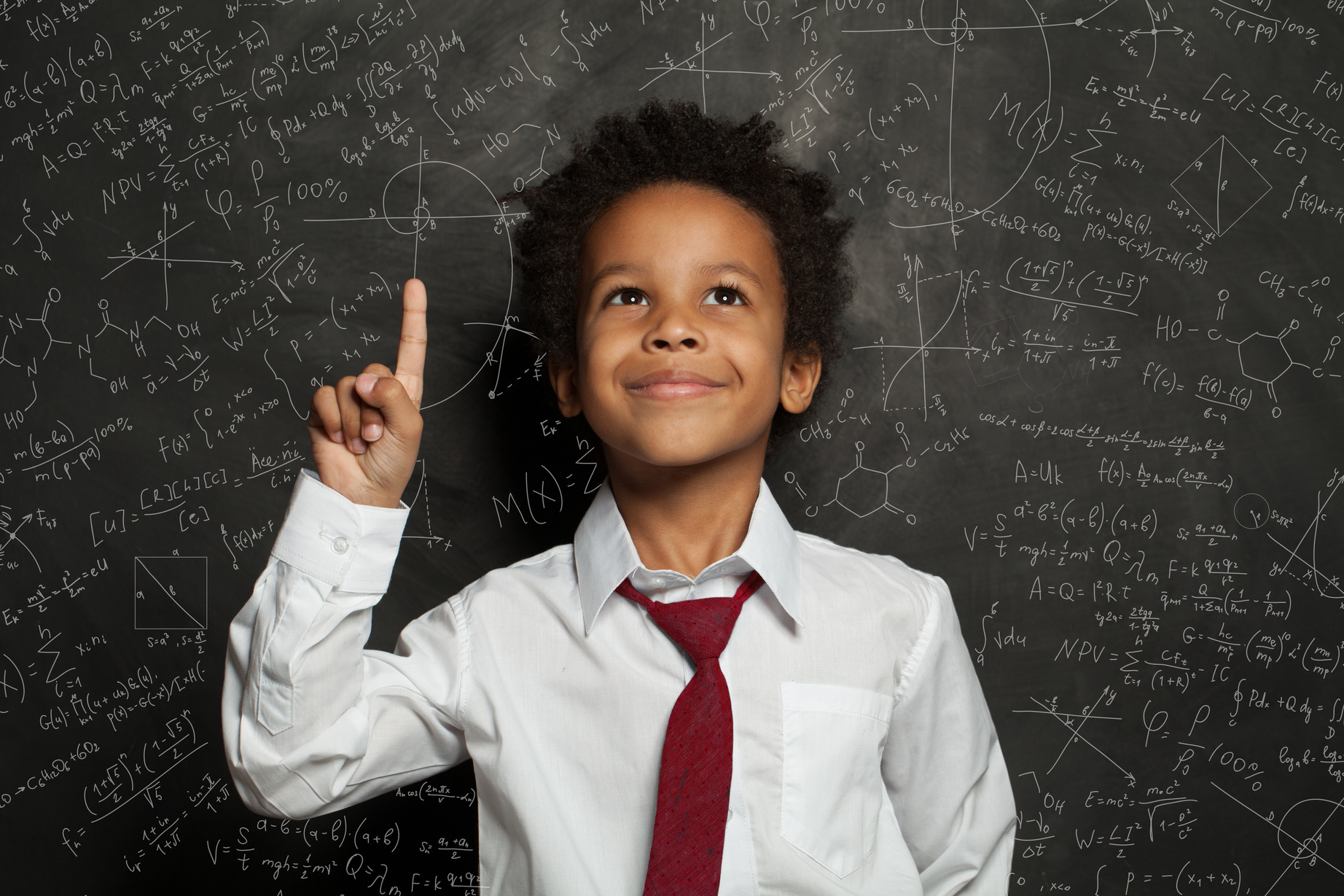 Black kid student pointing at science formulas on chalkboard